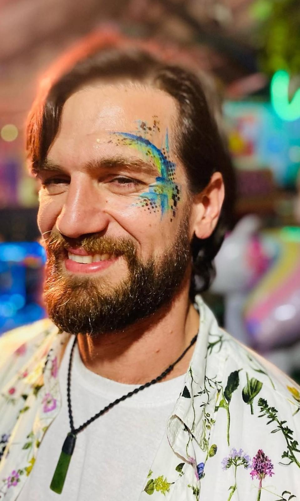 Bright fairy face painting — Arian Baynes Little Smiles Auckland
